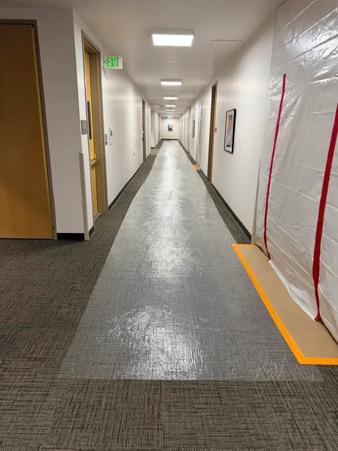 Corridor floors fully covered with protective board